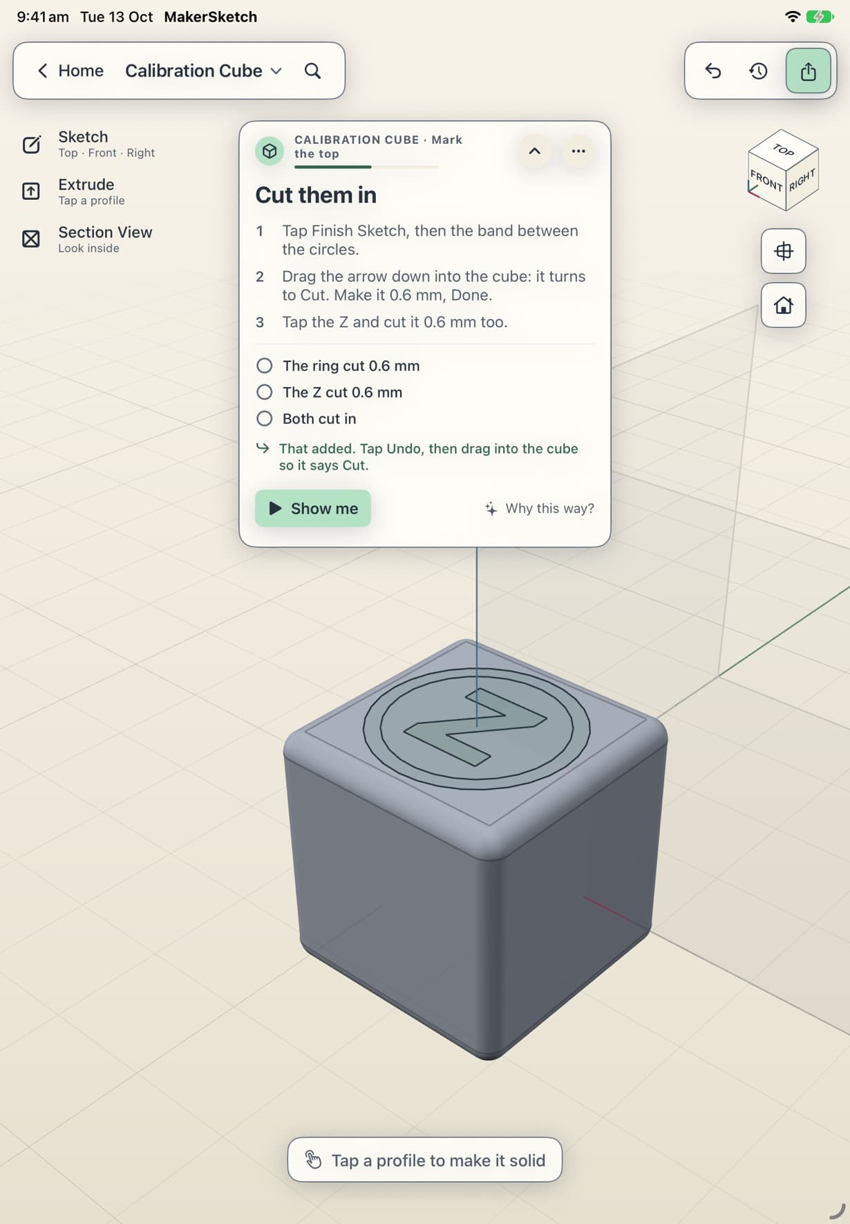 A ring and the letter Z sketched on the cube's top face, with the coach card listing the cut to make next.